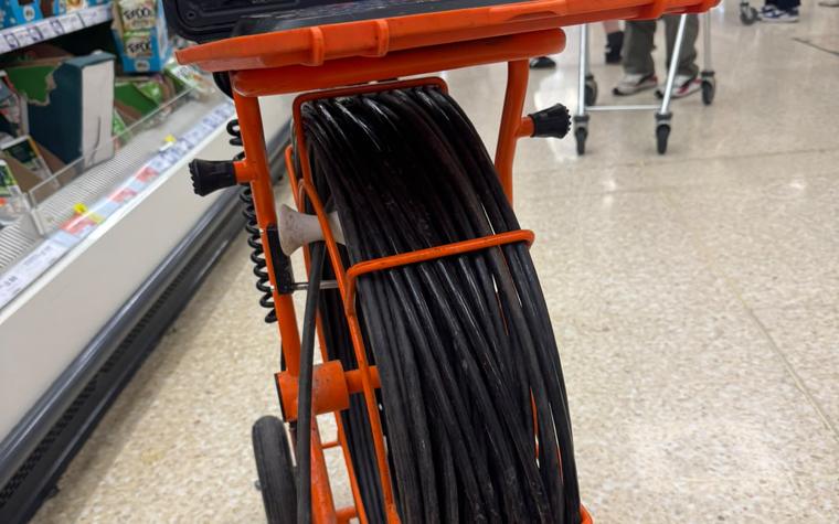 Drainage survey reel set up inside a working shop