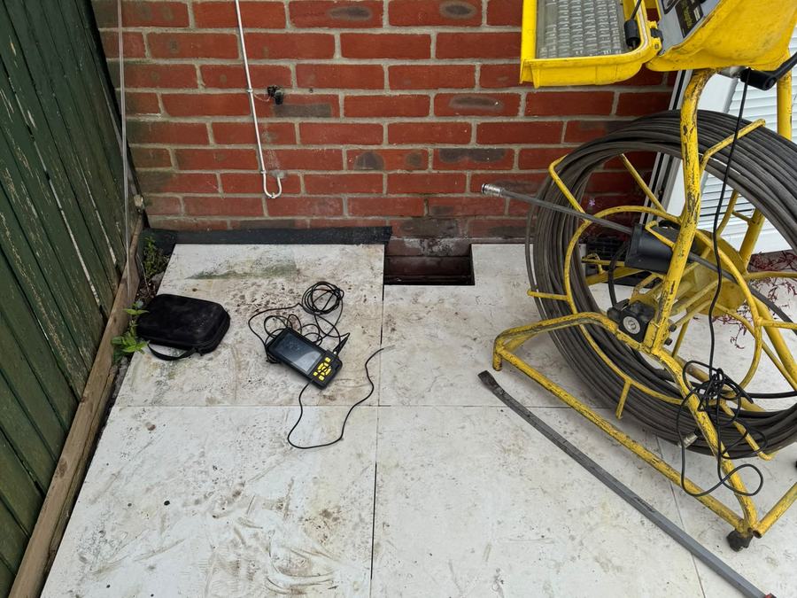 Rod and hose reels at a rear alley drainage job